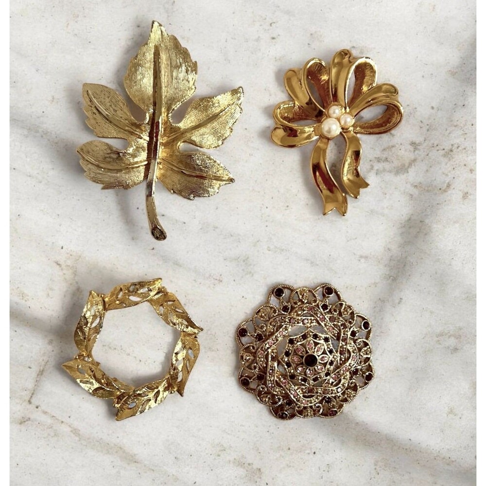 Lot 4 gold tone pins textured, leaves, circle, bow by Avon, filigree vtg